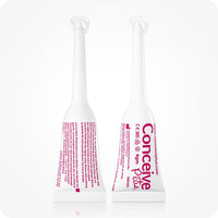 Conceive Plus Fertility Lubricant Combo featuring two pre-filled vaginal applicators standing upright side-by-side, displaying front and back label views with product details, dosage information, and branding in pink text on a white background.