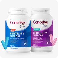 Conceive Plus His and Her Fertility Support Supplements bundle featuring two white bottles—one with blue branding for men’s fertility support and one with purple branding for women’s fertility support—each containing 60 vegan capsules, with blue and pink capsules displayed alongside for visual reference.