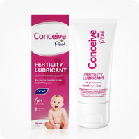 For Conceive Plus Maximum Fertility Bundle, image of fertility lubricant shown with its magenta retail box and 30ml white tube, labeled to support sperm quality and pH balance for couples trying to conceive, featuring calcium and magnesium ion icons and an infant image on packaging.