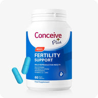 Conceive Plus Men’s Fertility Support Supplements bottle with blue and white branding, shown front-facing, labeled for male reproductive health, 60 vegan capsules, with two blue capsules displayed beside the container.