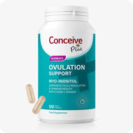 Conceive Plus Ovulation Support Supplements bottle, teal and white label, 120 vegan capsules, with two beige capsules displayed beside the container, featuring myo-inositol, COQ10, and ginger for cycle regulation and ovarian health support.